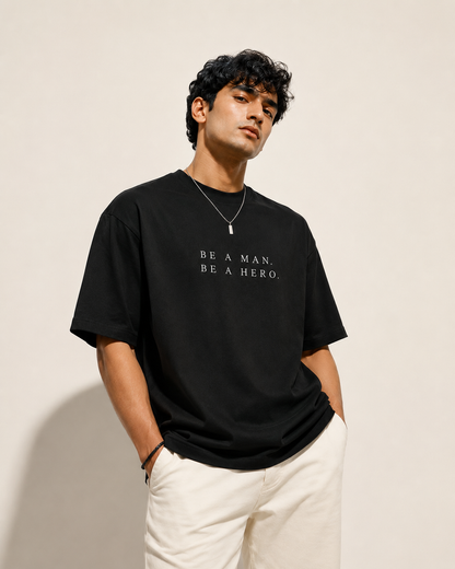 BE A MAN. BE A HERO. — Unisex Stretch T-Shirt